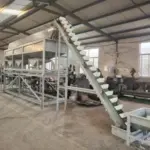 Raw material elevator