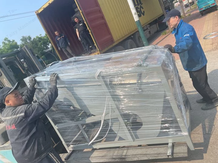 Workers laminating the machine